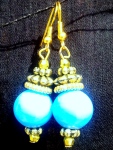 Blue glass bead with golden beads and findings