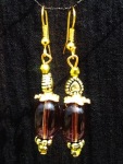 Brown glass bead with golden beads and findings