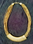 Gold bead strands with golden metal wrapped centre