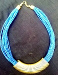 Blue bead strands with golden metal wrapped centre