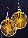 Yellow coloured thread spoked on metal circle earrings