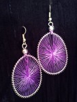 Lavender coloured thread spoked on metal circle earrings